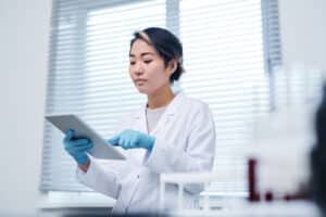 Female researcher looking at an ipad