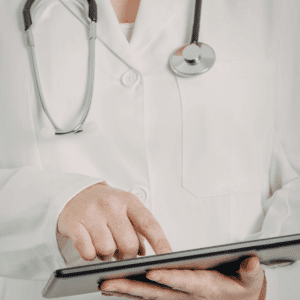 doctor holding ipad in their hands